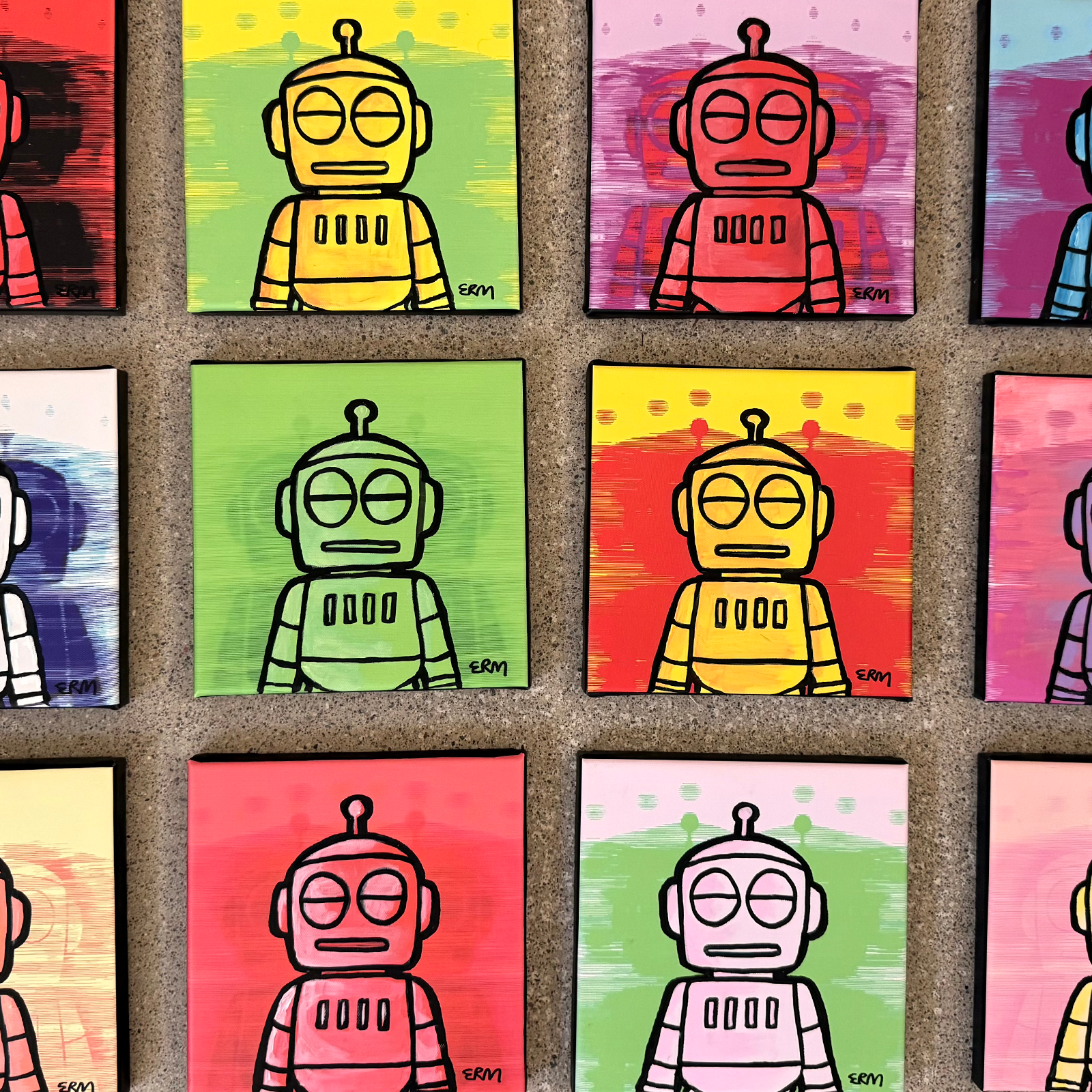 Close-up of the completed small Robo Zero canvases in different colours